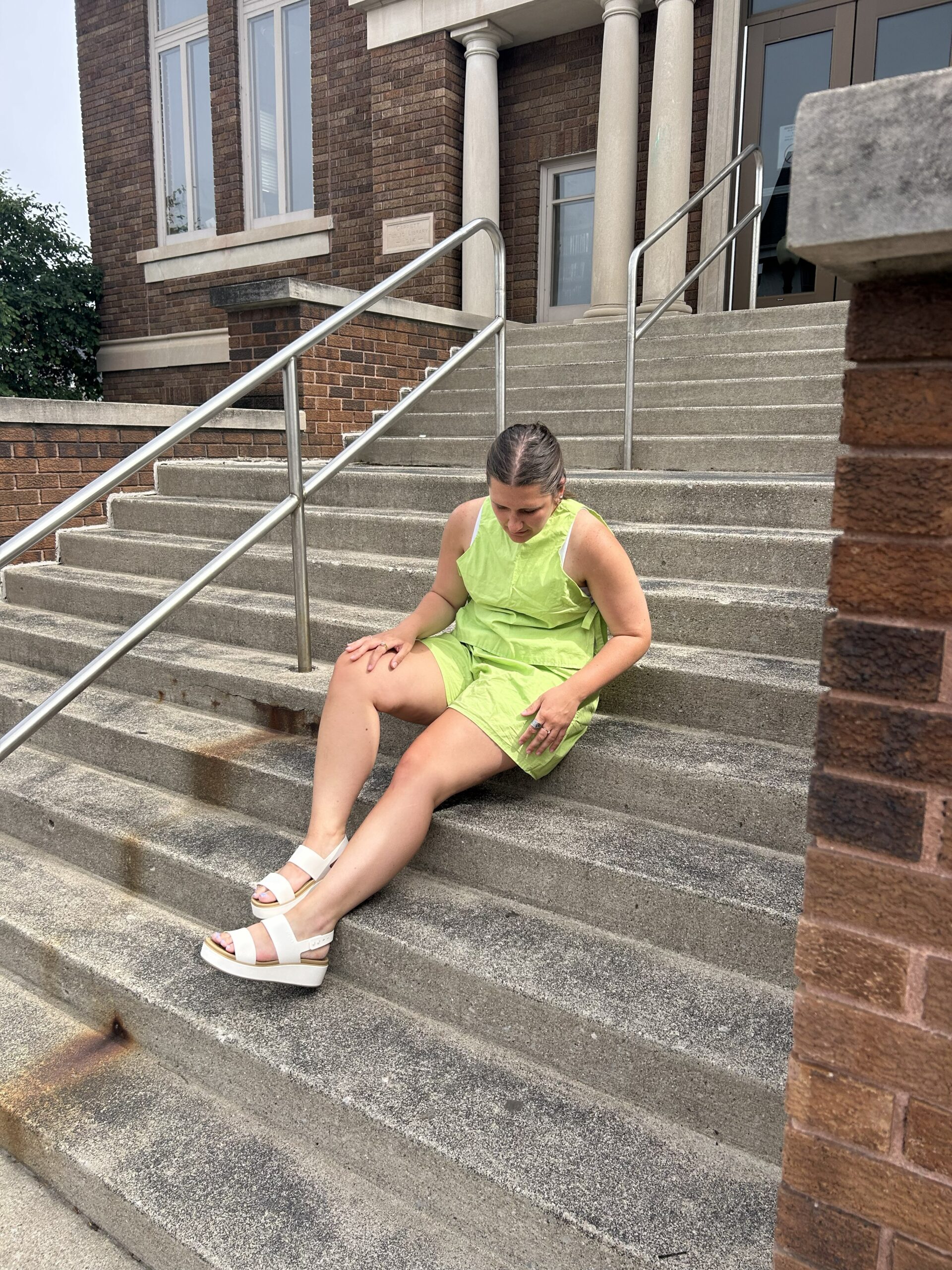 Woman modeling handmade lime green matching set shorts and tank top