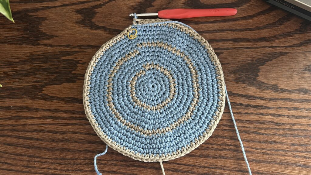Crochet bucket hat switched to blue cotton yarn after straight body round