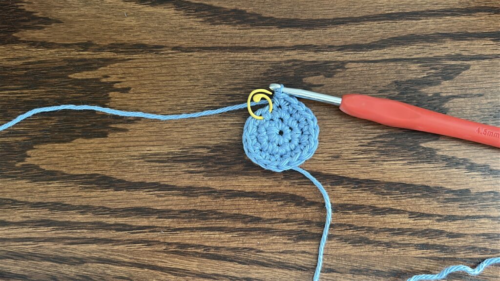 Crochet bucket hat after third increase round, blue cotton yarn