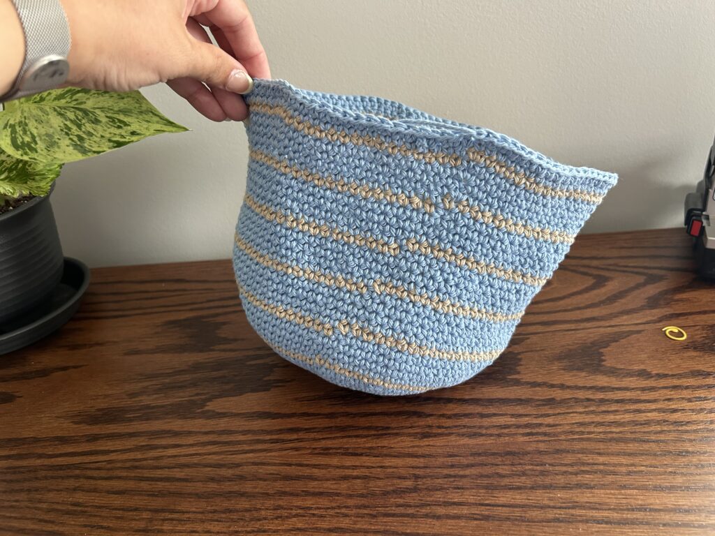 Tie off crochet bucket hat with slip stitch in blue cotton yarn